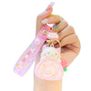 kawaii kattensleutelhanger met schattige witte kat op cakerol