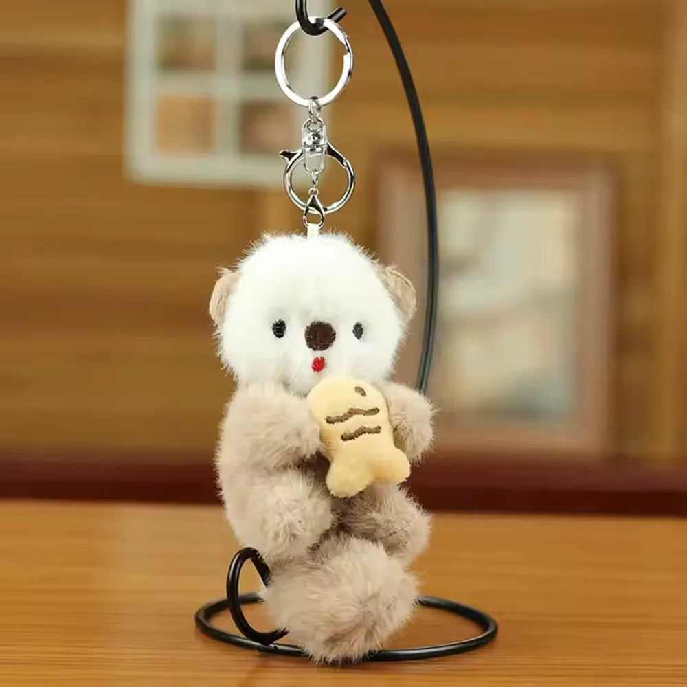 Pluche sleutelhanger otter met visje, kawaii en schattig accessoire